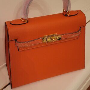 Fancy! Orange fashion bag. New, never used! No brand